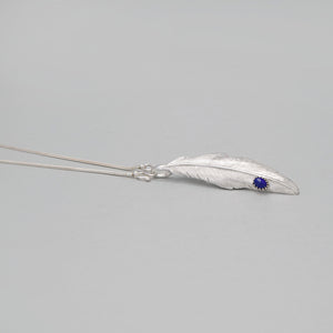 WHITE BRASS FEATHER PENDANT WITH LAPIS DROP