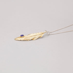 YELLOW BRASS FEATHER PENDANT WITH LAPIS DROP