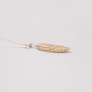 FEATHER OVERLAY PENDANT IN YELLOW BRASS