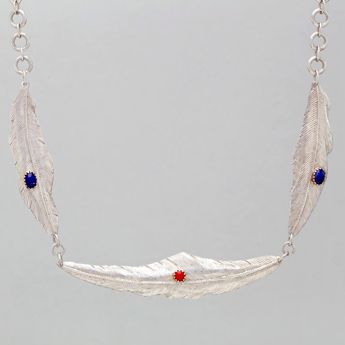 TRIPLE FEATHER NECKLACE IN STERLING SILVER WITH LAPIS AND CORAL STONES