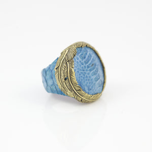EXOTIC SKIN RING IN TURQUOISE WITH YELLOW BRASS FEATHER CROWN