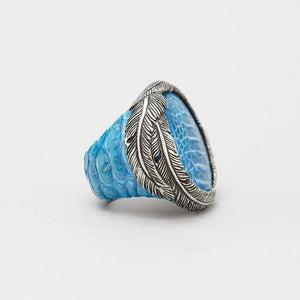 EXOTIC SKIN RING IN TURQUOISE WITH WHITE BRASS FEATHER CROWN