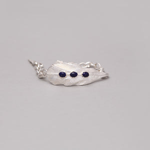 SILVER PLATED FEATHER CHAIN LINK BRACELET WITH LAPIS ACCENT