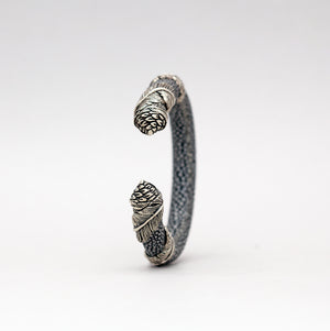 EXOTIC CUFF WITH SILVER PLATED FEATHER WRAP CAPS